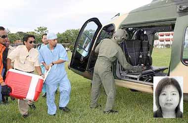 Special delivery: Doctors rushing to place organs donated by Chiew (pic) onto a helicopter yesterday.