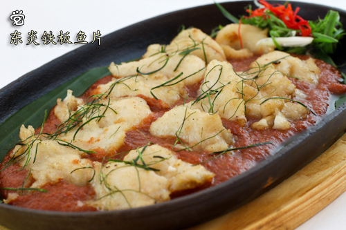Tom yam fish fillet served in hot plate