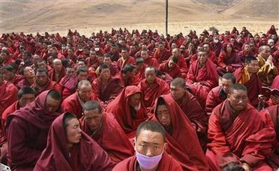 Tibetan monks attend a mass prayer for earthquake victims in the quake-hit Gyegu town of Yushu county, Qinghai province April 20, 2010. China will hold a national day of mourning for victims of an earthquake in the country's western region, the government announced on Tuesday, as the official death toll from the disaster climbed to 2,039, state media reported. REUTERS/Stringer 