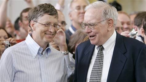 Bill Gates, left, and Warren Buffett, seen in this 2007 photo during the annual Berkshire Hathaway shareholders meeting in Omaha, are trying to persuade other American billionaires to give at least half their wealth to charity. 