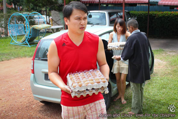 Argen and Cindy making donation to the Handicapped and Mentally Disabled Children Centre Melaka