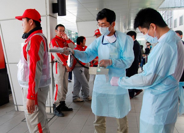 Technicians scan Red Cross rescue workers for signs of radiation in Nagahama City, Shiga Prefecture in northern Japan, after an earthquake and tsunami struck the area, March 14, 2011. (Photograph: Reuters/Kyodo) Technicians scan Red Cross rescue workers for signs of radiation in Nagahama City, Shiga Prefecture in northern Japan, after an earthquake and tsunami struck the area, March 14, 2011. (Photograph: Reuters/Kyodo)