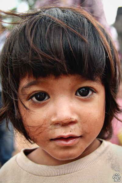 innocent kid at the entrance of Angkor Wat