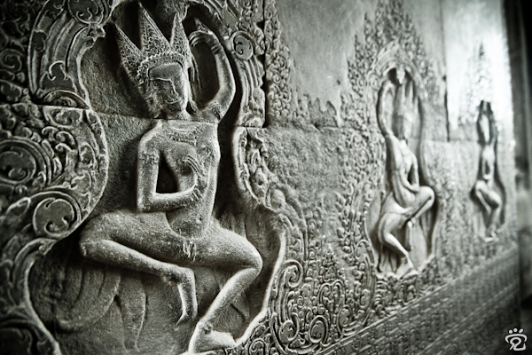 dancing ladies carved in relief on the walls of the temple