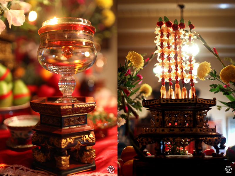 oil lamp (left); bamboo skewers of preserved papaya and cherries on top of the chanab as offering (right)