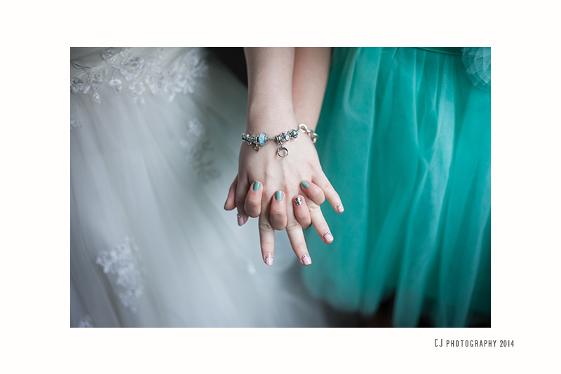 Soft color and cute manicure on the fingers of bride and sister