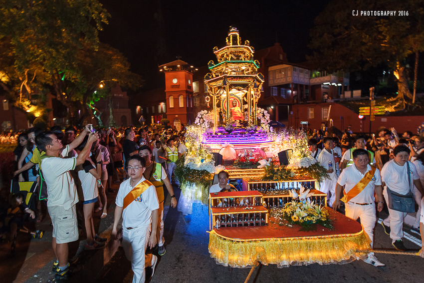 One of the float from Seck Kia Eenh Buddhist Temple passing by the iconic Clock Tower outside Stadthuys of Melaka