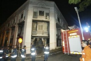 Fire rescue personal inspect the damage after unidentified attackers set fire to a church in Malaysia, early Friday, Jan. 8, 2010. Officials say unidentified attackers have set fire to a church in Malaysia amid a growing conflict in the country over the use of the word "Allah" by non-Muslims. (AP Photo)