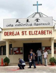 The St Elizabeth Catholic church in Kota Kecil, Kota Tinggi in Johor was splashed with red paint early Thursday morning. - Abdul Rahman Embong/The Star
