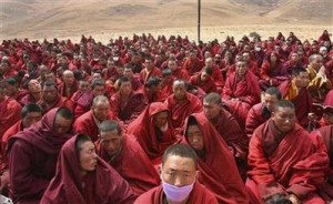 Tibetan monks attend a mass prayer for earthquake victims in the quake-hit Gyegu town of Yushu county, Qinghai province April 20, 2010. China will hold a national day of mourning for victims of an earthquake in the country's western region, the government announced on Tuesday, as the official death toll from the disaster climbed to 2,039, state media reported. REUTERS/Stringer