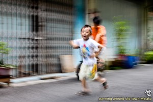 a zooming and panning shot of the kids on Lorong Jambatan