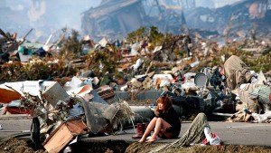 A woman cries amid the destruction in Natori, Japan (Reuters photo)
