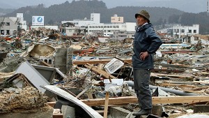 A man surveys the damage in Minami Sanriku, a town in Miyago Prefecture, on Tuesday, March 15. (AFP photo)