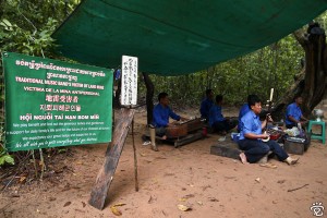traditional music band's victim of land mine at the side of pathway