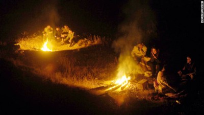 Residents of Ercis, Turkey, gather around fires in the aftermath of a 7.2-magnitude earthquake that rocked the city on Sunday.