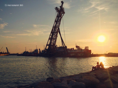 Couple sighted under the sunset at the beach of Taman Kota Laksamana (iPhonegraphy)
